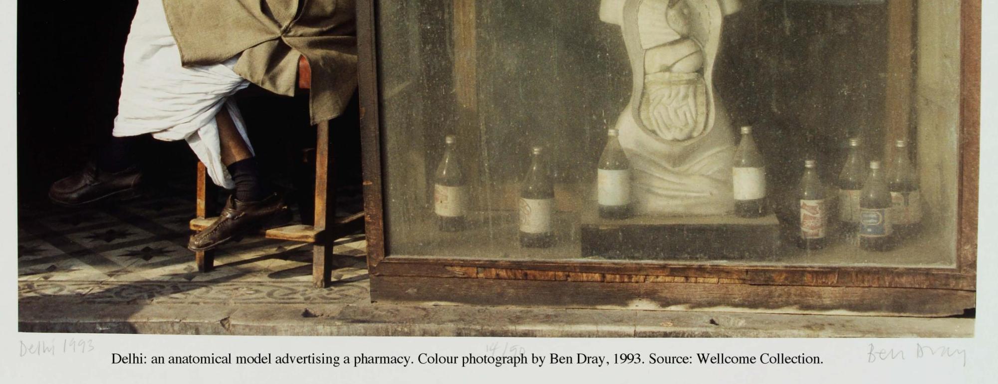 Delhi: an anatomical model advertising a pharmacy. Colour photograph by Ben Dray, 1993. Source: Wellcome Collection.